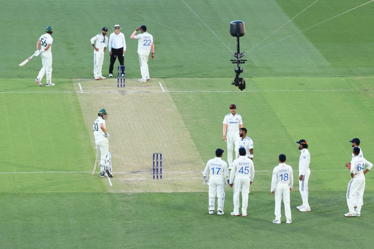 ADELAIDE, AUSTRALIA - DECEMBER 07: Jasprit Bumrah of India interacts with Pat Cummins of Australia during day two of the Men's Test Match series between Australia and India at Adelaide Oval on December 07, 2024 in Adelaide, Australia. (Photo by Paul Kane/Getty Images)