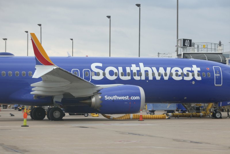 Southwest Airlines is ending in-flight service earlier than it previously did in an effort to reduce the risk of injury to its cabin crews. File Photo by Bill Greenblatt/UPI