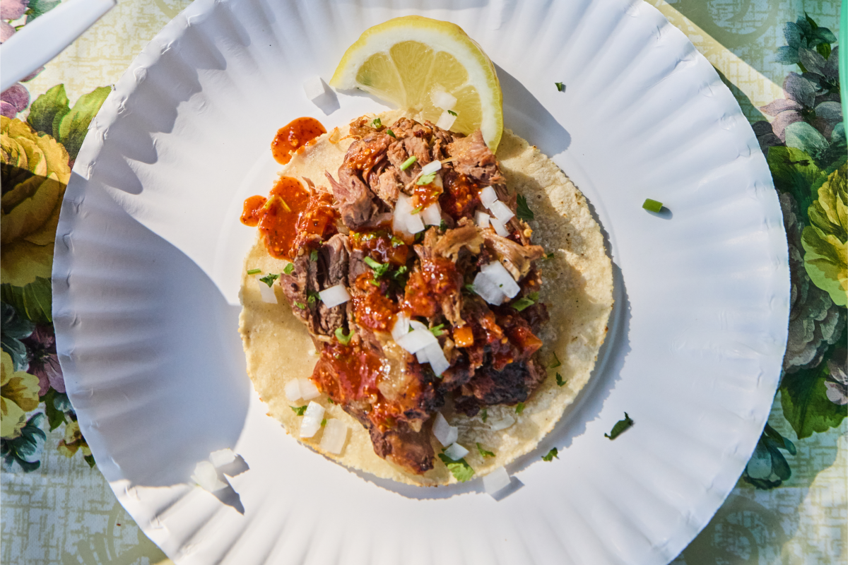 A taco on a paper plate from Barbacoa Ramirez