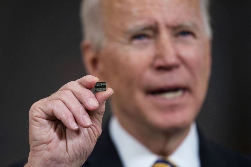 President Joe Biden holds up a semiconductor as he delivers remarks before signing an Executive Order on the economy in the State Dining Room at the White House in Washington, D.C., on February 24, 2021. On Monday, his administration announced further rules to prohibit the export of semiconductor technology to China. Pool File Photo by Doug Mills/UPI