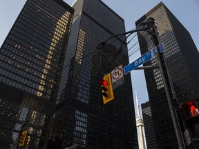 A street light on Bay Street in Canada's financial district is shown in Toronto on Wednesday, March 18, 2020.