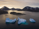 Large Icebergs float away as the sun rises near Kulusuk, Greenland. Donald Trump repeated his desire for the U.S. to buy Greenland, the world's largest island.