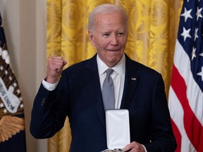 U.S. President Joe Biden presents the Presidential Citizens Medal to Eleanor Smeal during a ceremony at the White House in Washington, DC, on January 2, 2025.