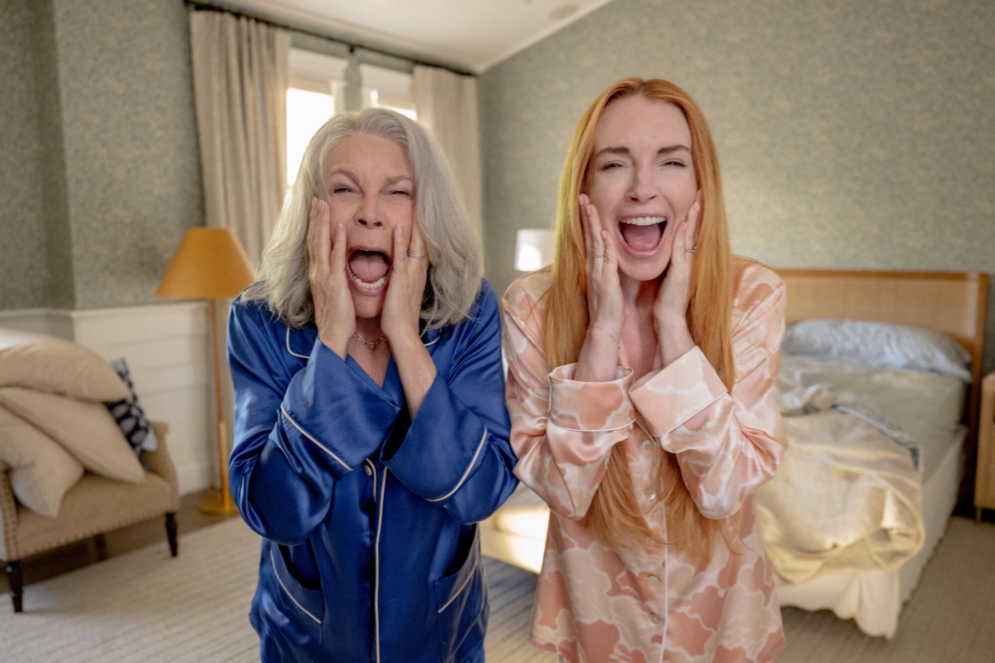 A mother and daughter scream at the lens.