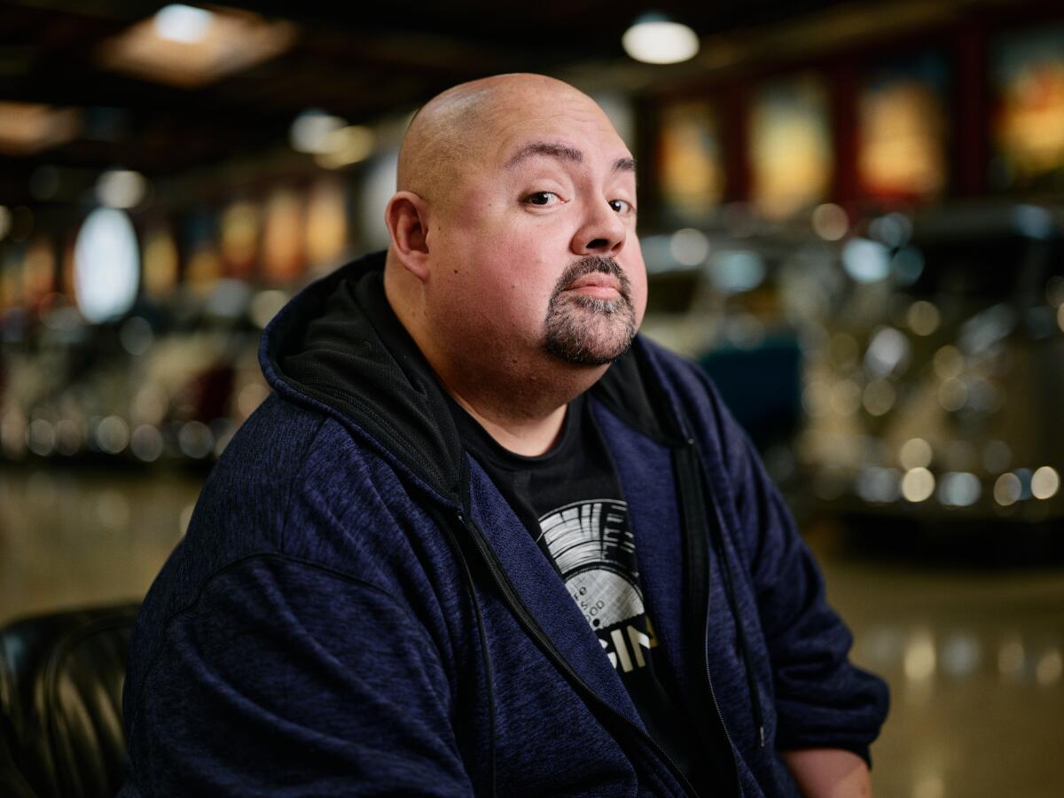 Portrait of Gabriel Iglesias inside his garage compound. 