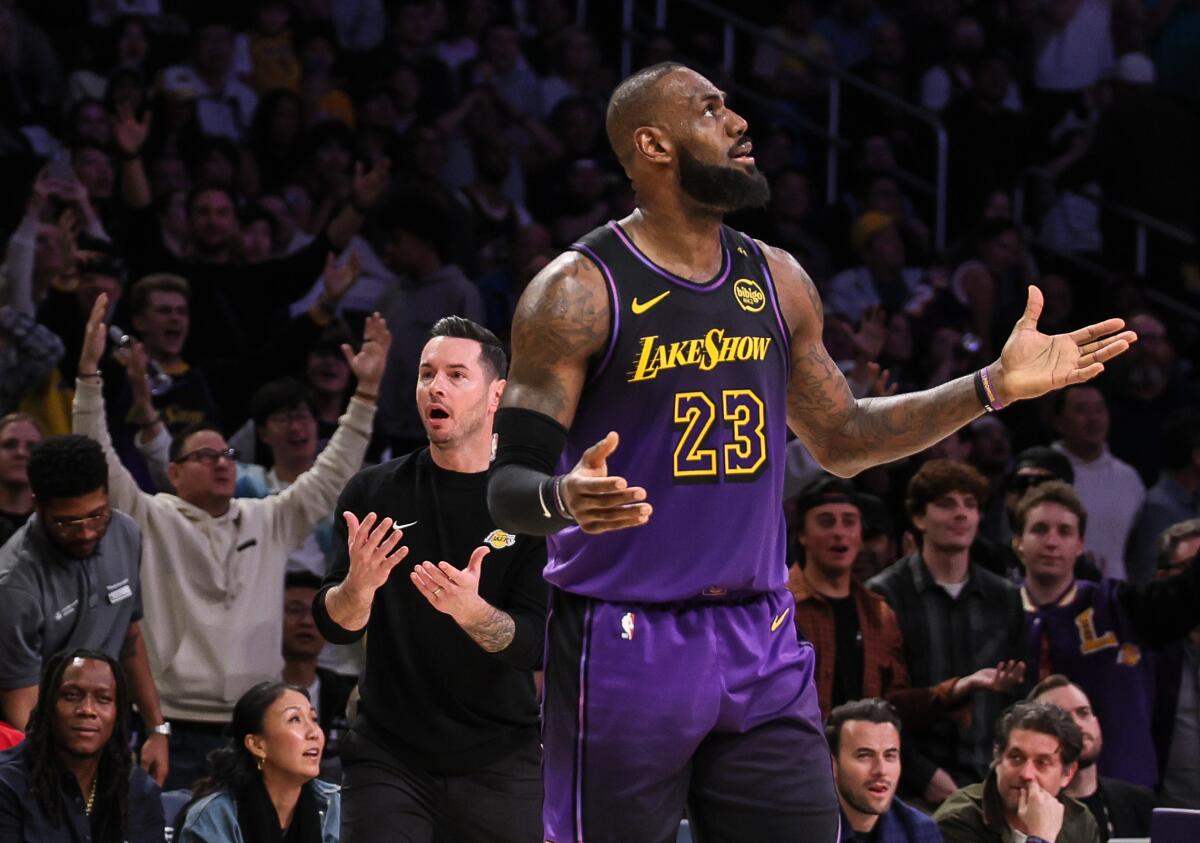 Lakers star LeBron James and coach JJ Redick react to a goaltending call against the Lakers.