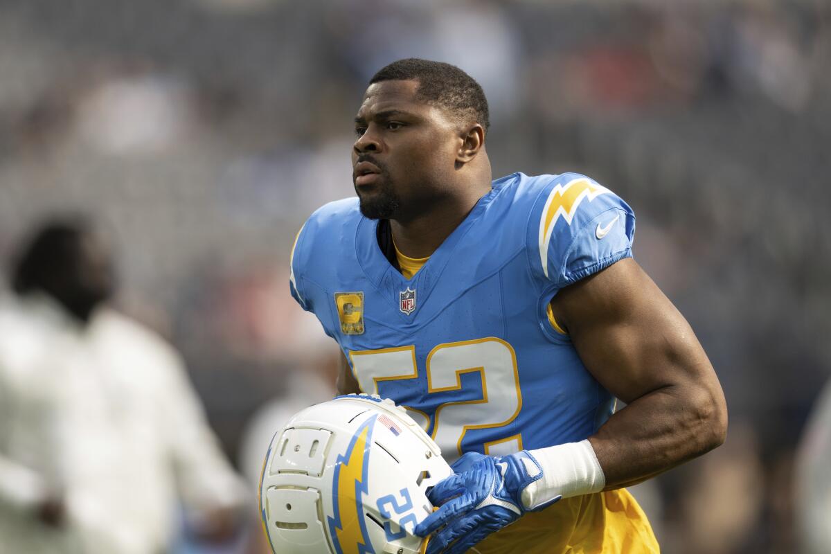 Chargers linebacker Khalil Mack jogs on the field before a game against the Tennessee Titans