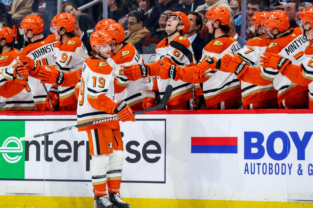 Ducks forward Troy Terry celebrates with teammates after scoring in the second period of a 4-3 overtime win.