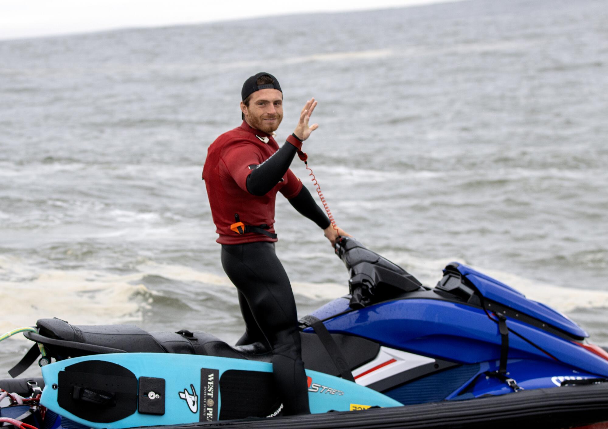 Alo Slebir waves from a jet ski at Mavericks in Half Moon Bay. 