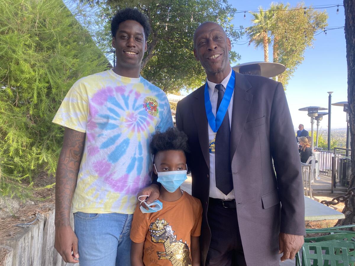 Dwayne Polee II, left, Dwayne Polee III, center, and Dwayne Polee pose for a photo.