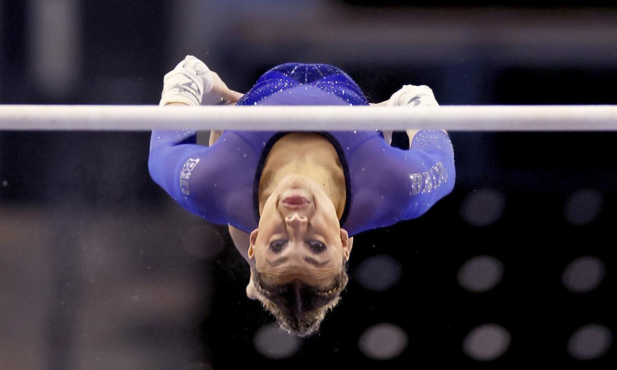 UCLA gymnast Macy McGowan performs on the uneven bars at the American Gold Women's Collegiate Gymnastics Classic.