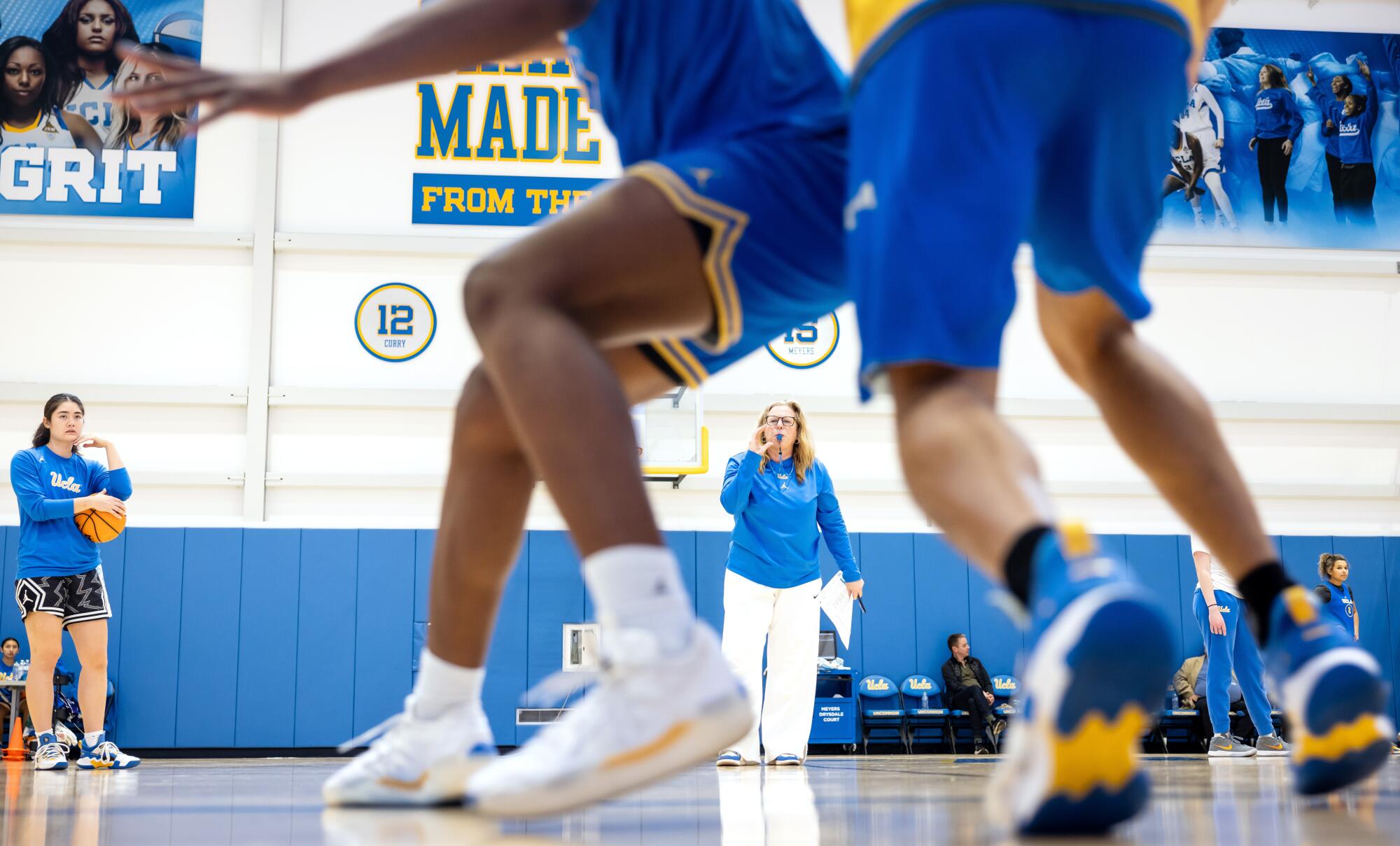 UCLA women's basketball coach Cori Close, center, runs practice at Mo Ostin Basketball Center.