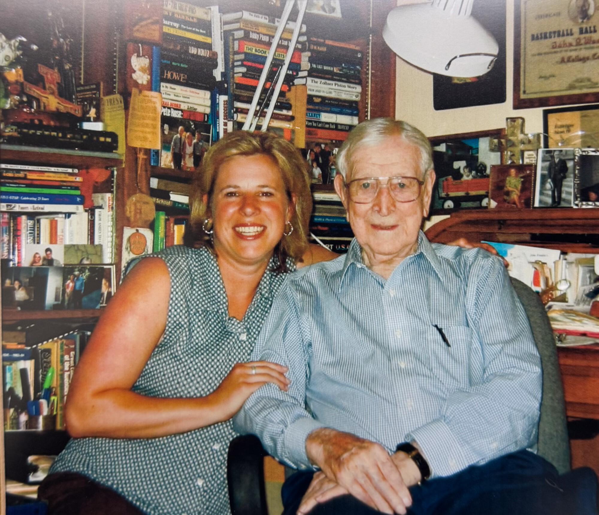 Cori Close, left, with legendary UCLA men's basketball coach John Wooden.