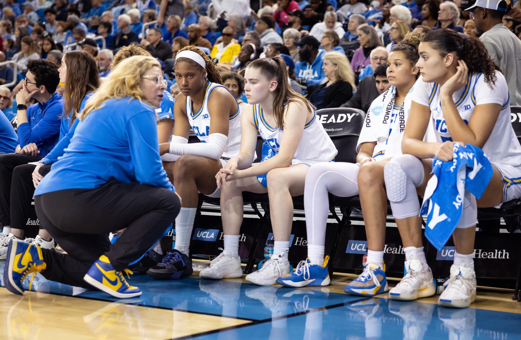 Cori Close talks to players on the bench during the game against Nebraska at Pauley Pavilion on Dec. 29