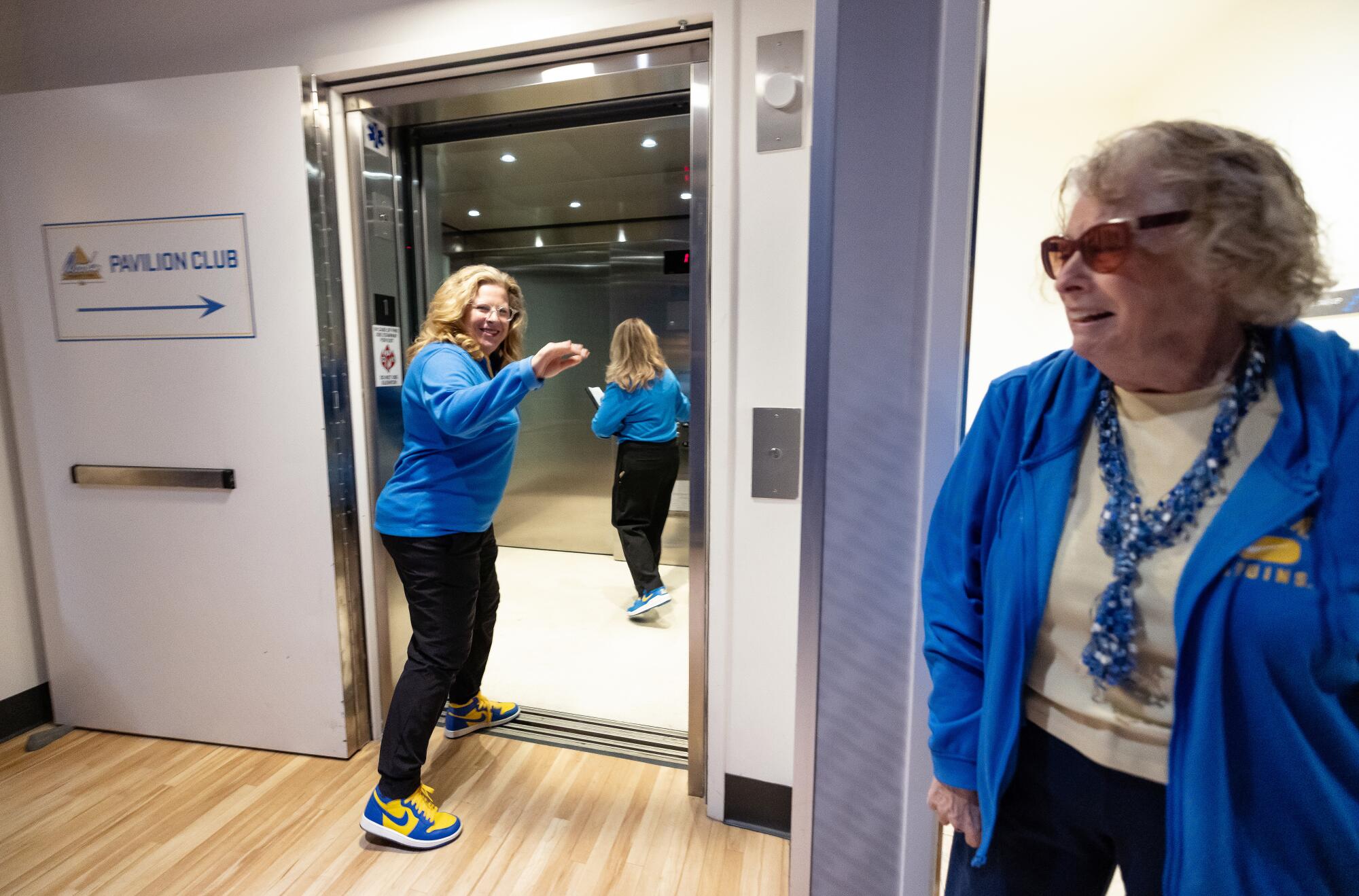 Cori Close, left, waves to her mom Patti Close, right, before a game at Pauley Pavilion.