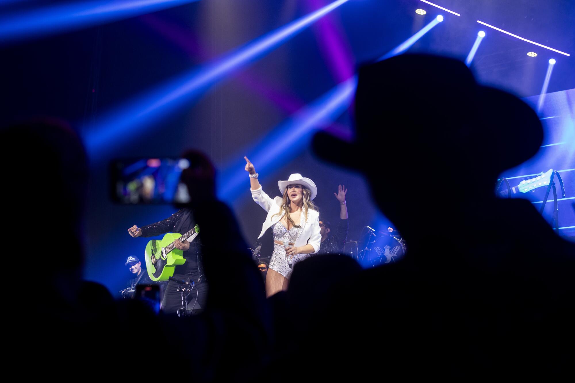 Wearing tejanas and matching botas, the crowd showed up ready to hear Chiquis' spin on música Mexicana.