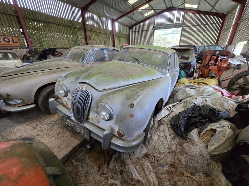 The cars in the graveyard include Jaguars, Porches, and Rolls Royces