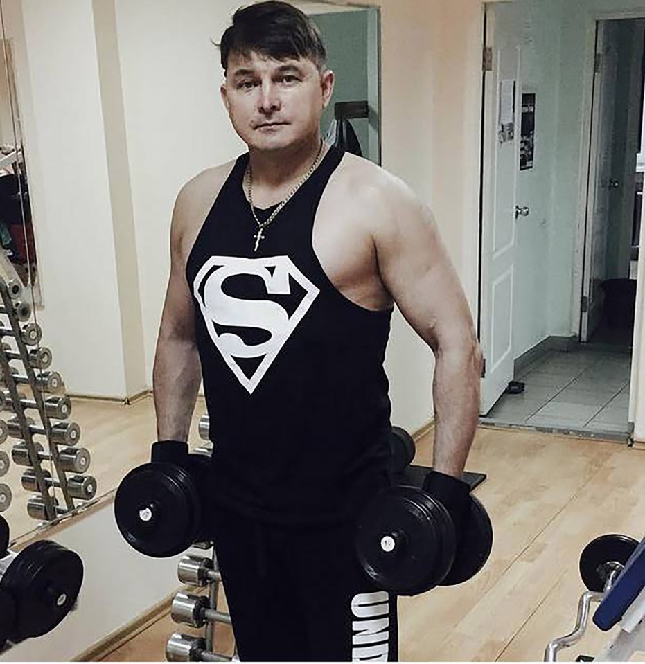 Yuriy Surakin, the victim, lifting weights in a gym