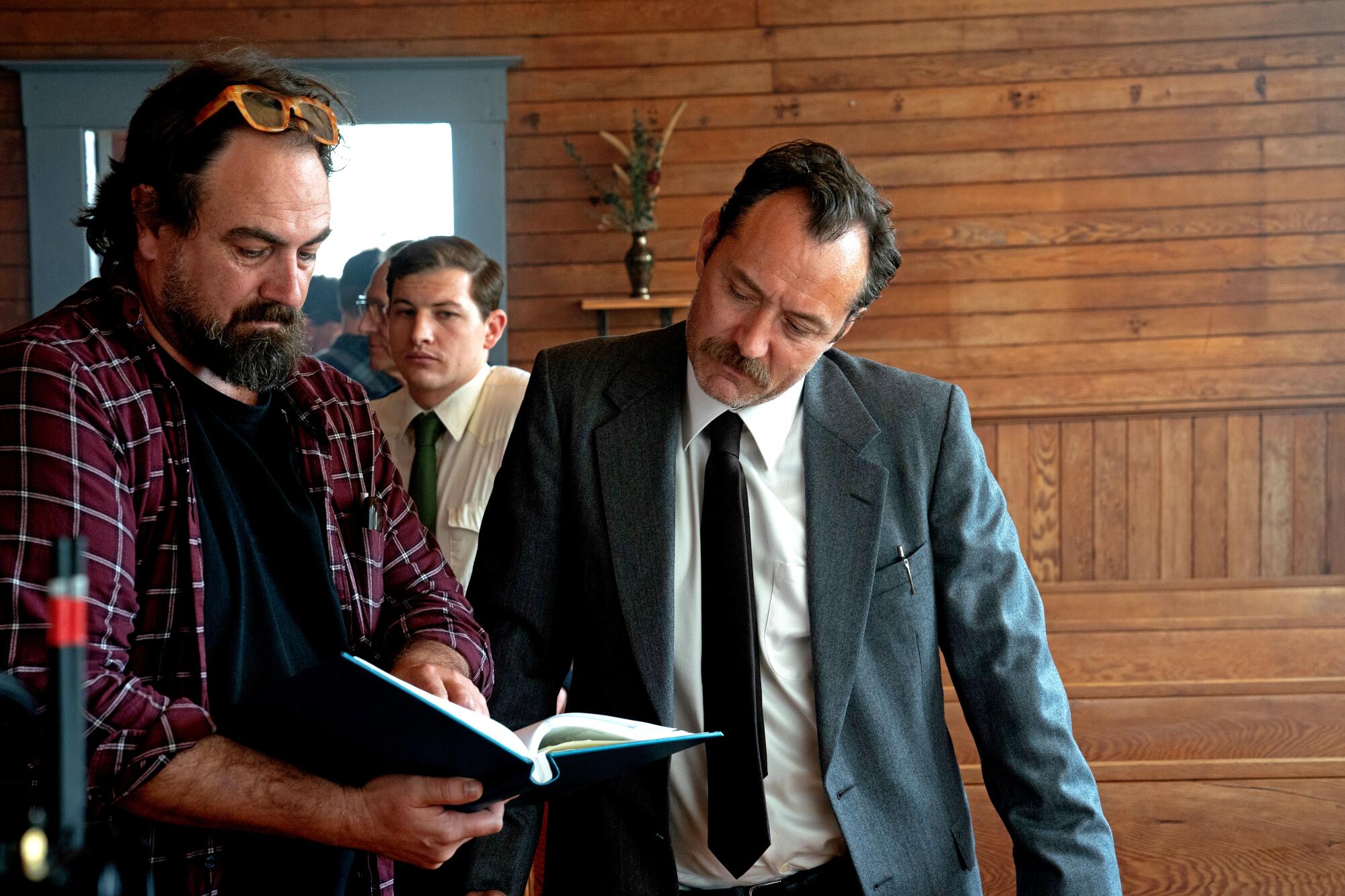 Jude Law and director Justin Kurzel confer on set.