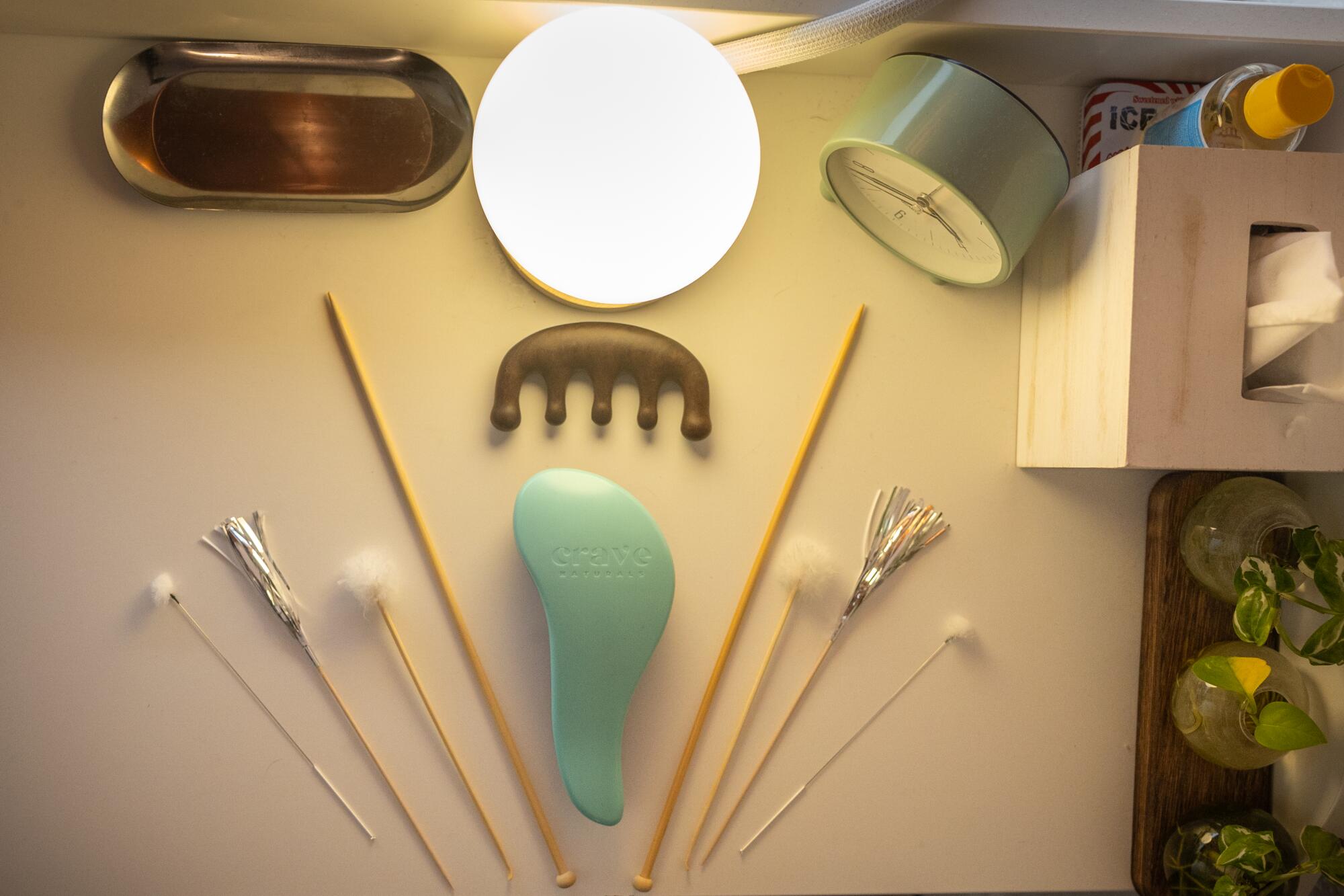 A table of tools that ASMR masseuse and content creator Julie Luther uses during her sessions.