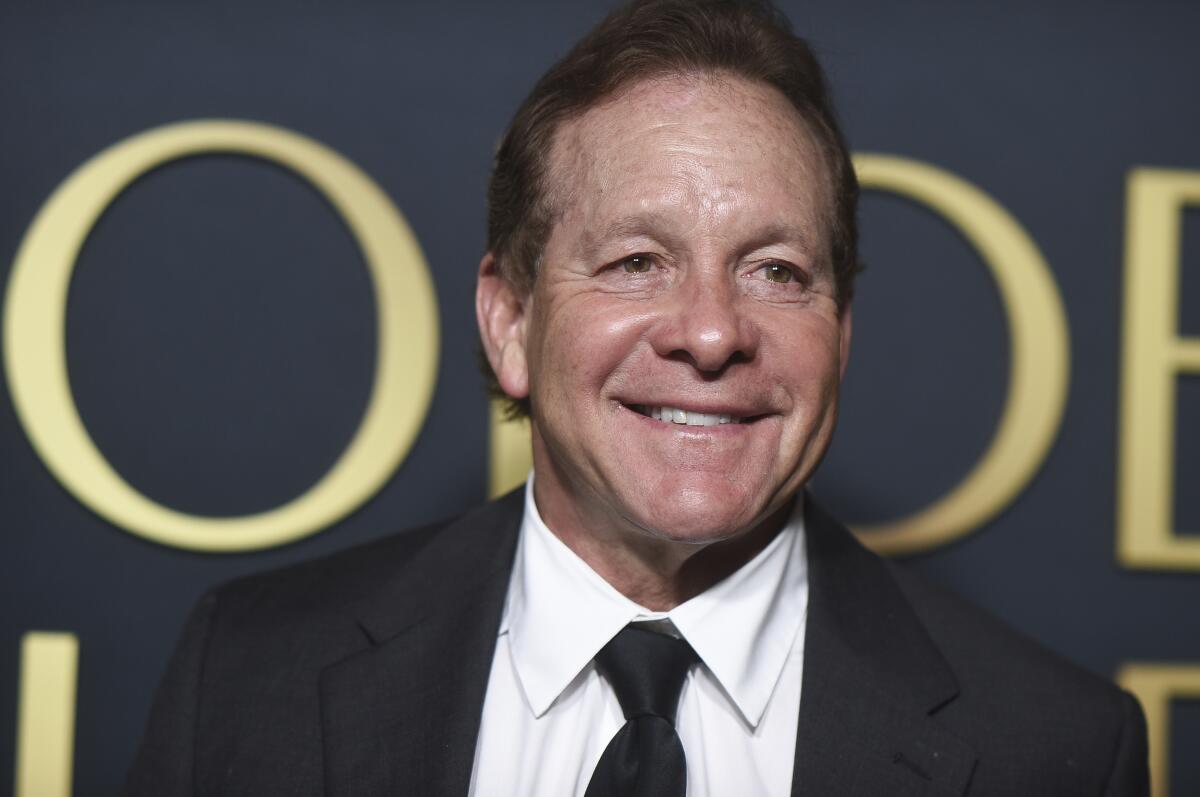 Steve Guttenberg smiles in a tuxedo