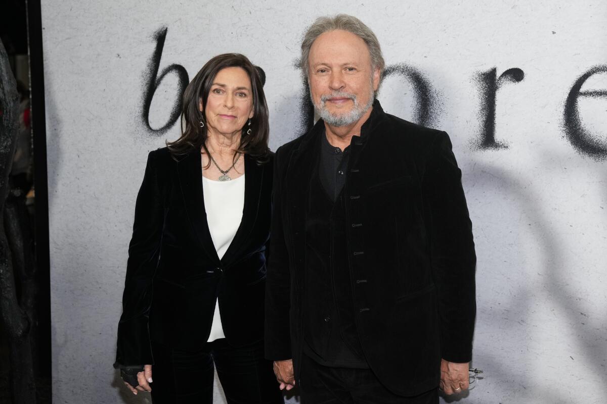 Janice Crystal, left, and Billy Crystal attend a premiere