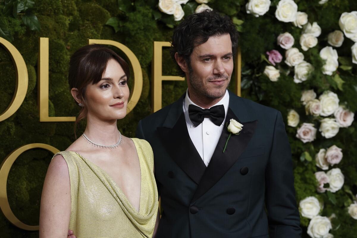 Leighton Meester, left, and Adam Brody reportedly lost their Pacific Palisades home.