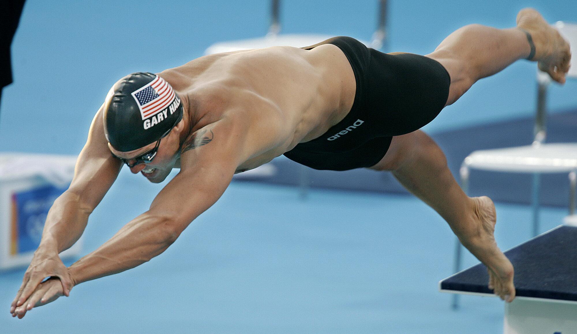 U.S. swimmer Gary Hall starts a semifinal of the 50-meter freestyle at the 2004 Olympic Games.