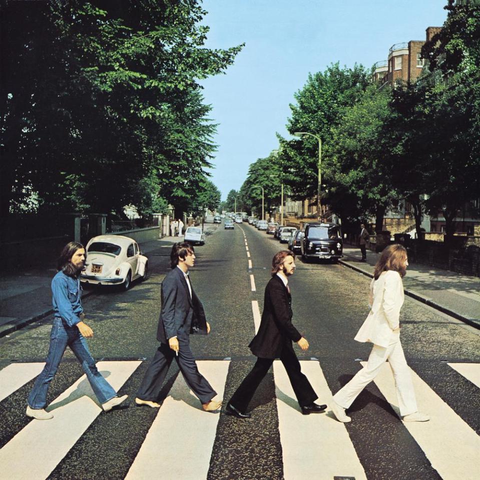 The Beatles crossing Abbey Road.