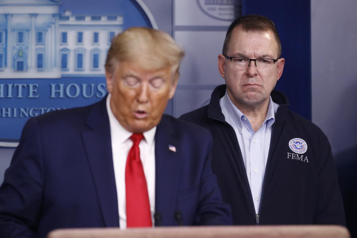 FEMA Administrator Peter Gaynor with President Trump at a coronavirus task force briefing at the White House in 2020.