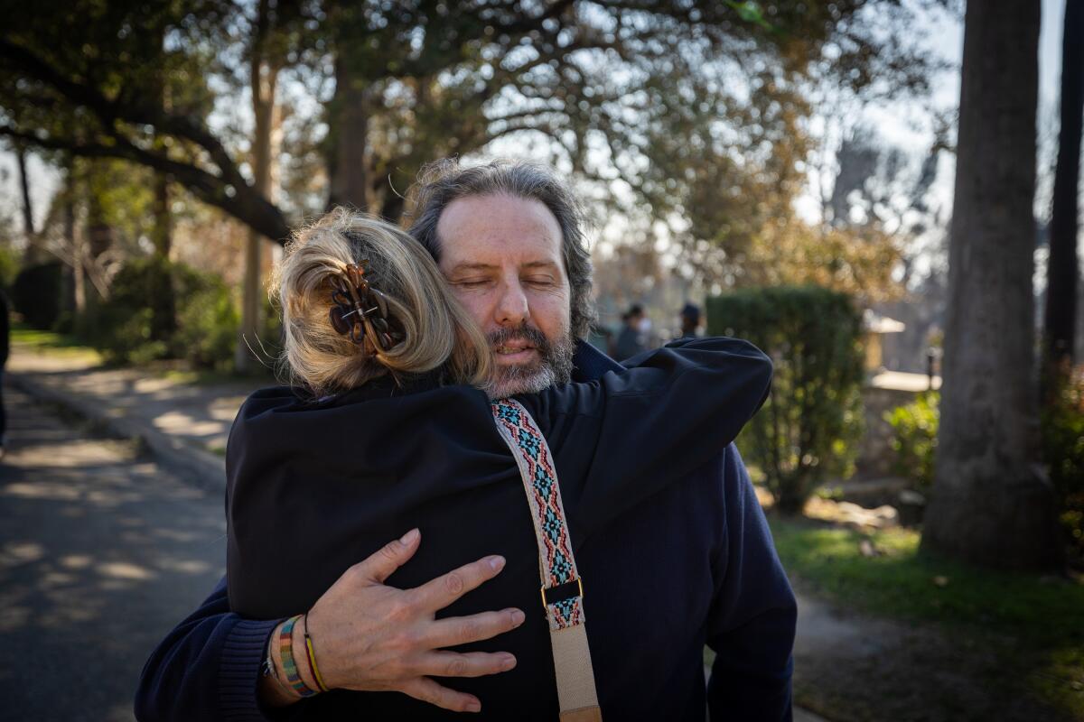 Los Angeles County Supervisor Kathryn Barger hugs Pablo Scarpellini.