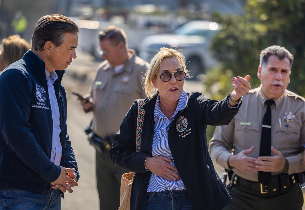 Los Angeles County Supervisor Kathryn Barger talks to California Attorney General Rob Bonta. 