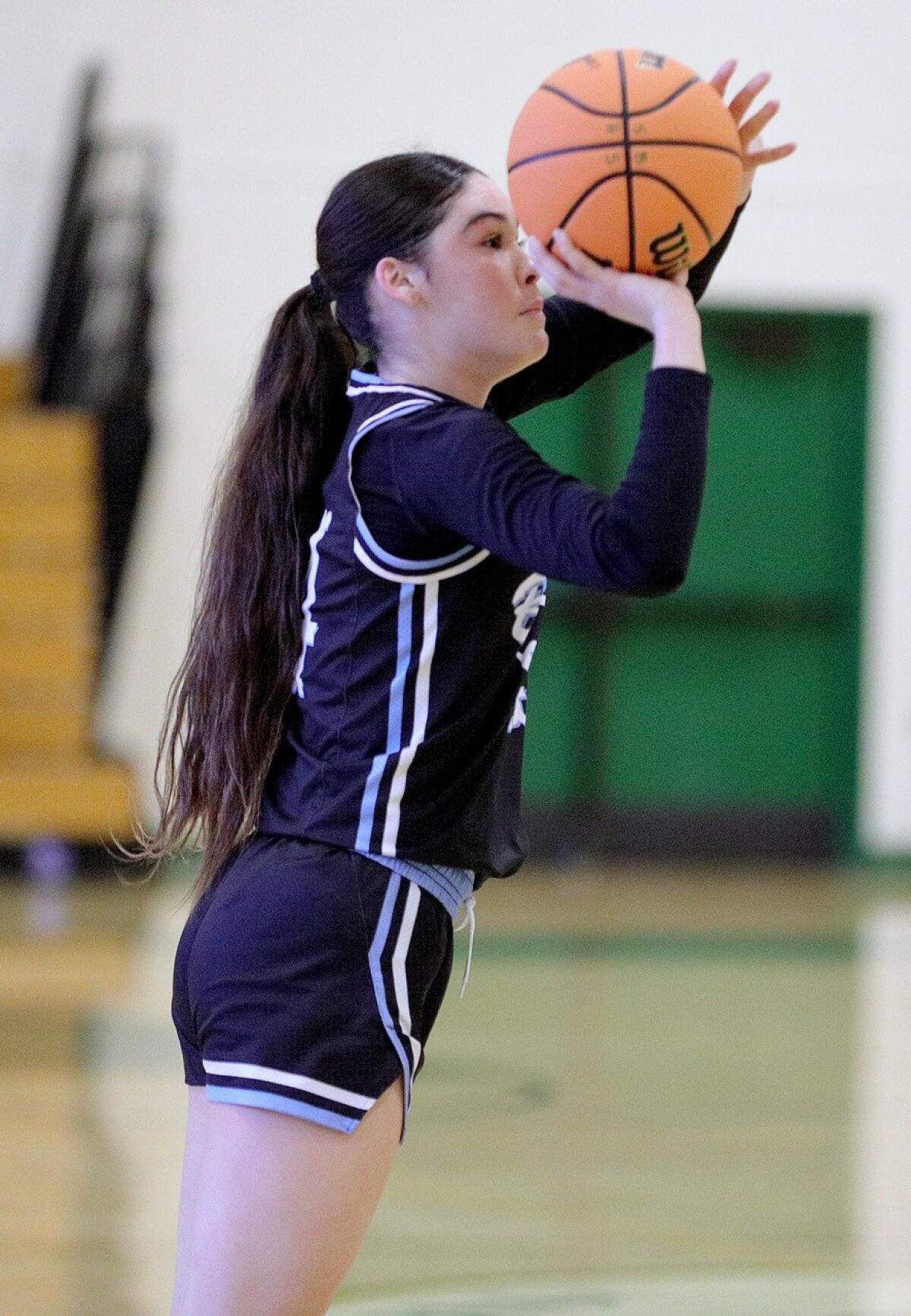 Karisma Lewis pulls up for a jump shot during a recent game.