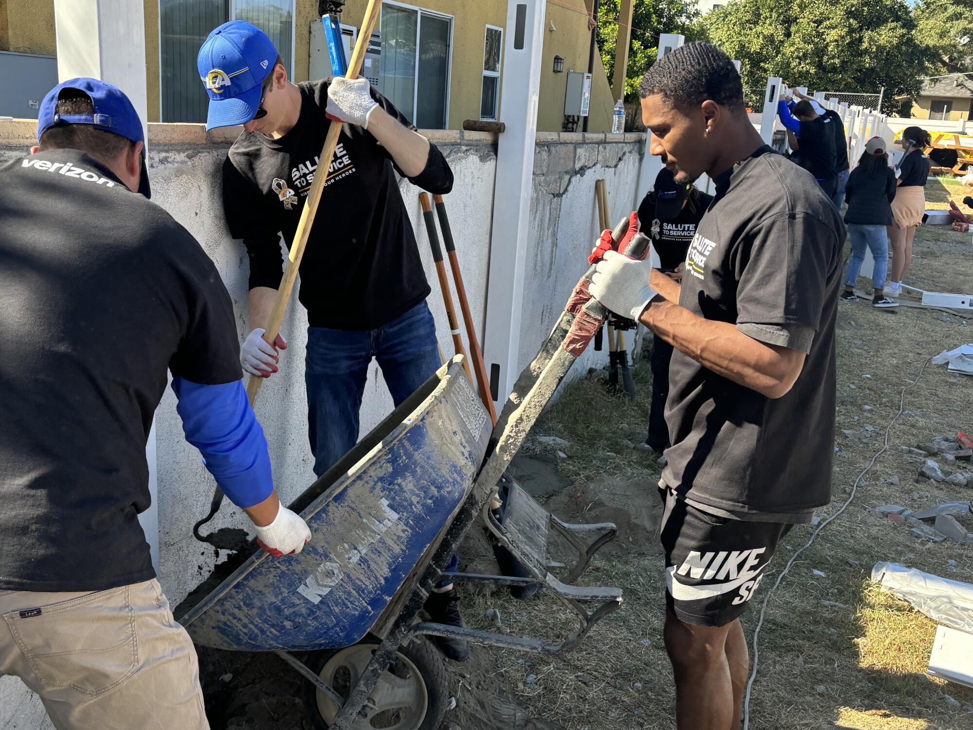 Rams safety Quentin Lake helps with construction of homes for multiple military veteran families in North Hollywood.