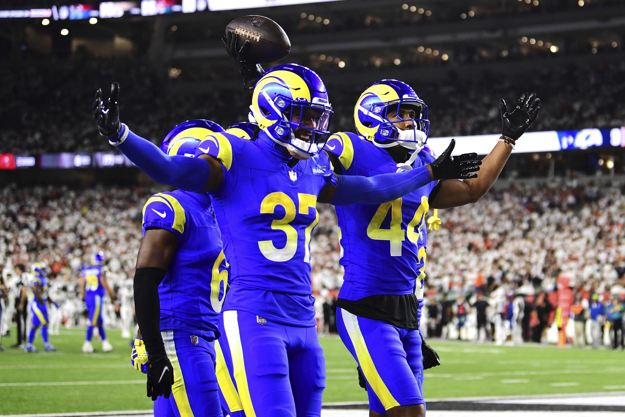 Rams safety Quentin Lake, left, and cornerback Ahkello Witherspoon celebrate an interception.