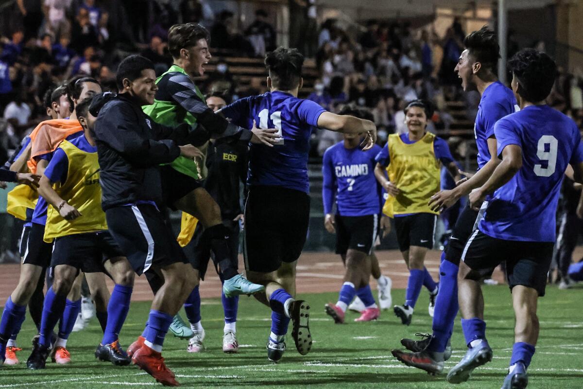 From 2022, El Camino Real soccer teammates celebrate after scoring against rival Birmingham.