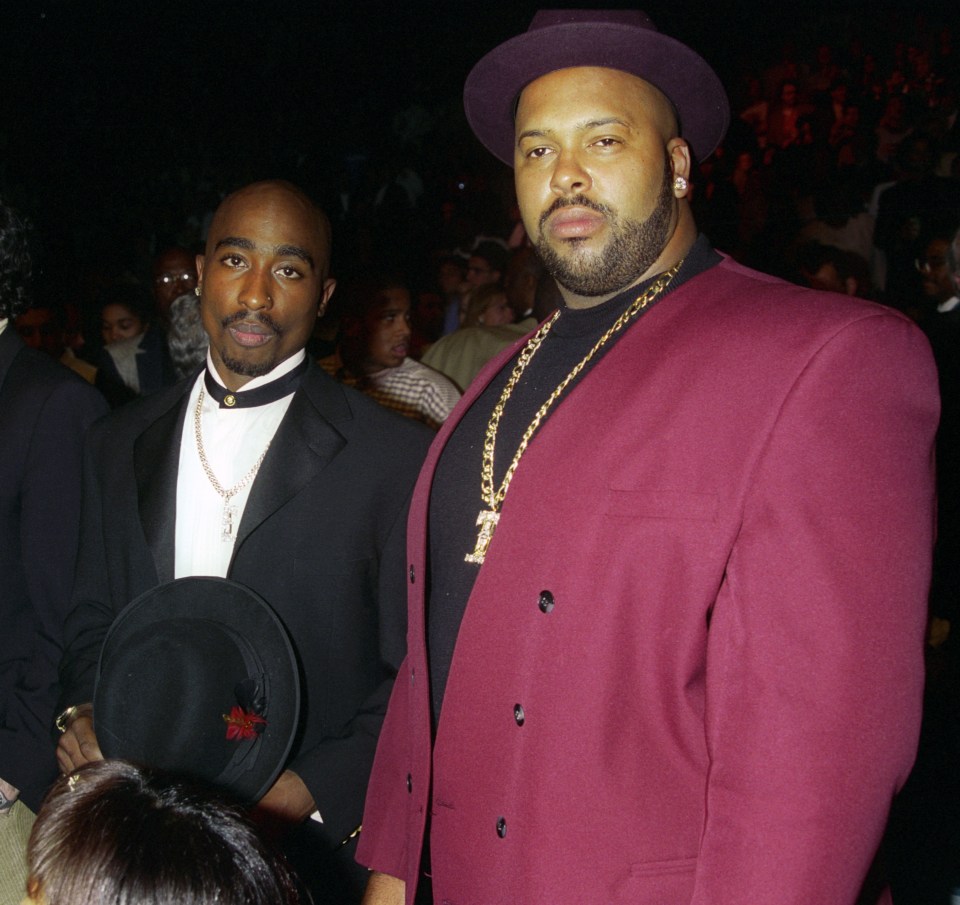 Tupac Shakur and Suge Knight at an event.