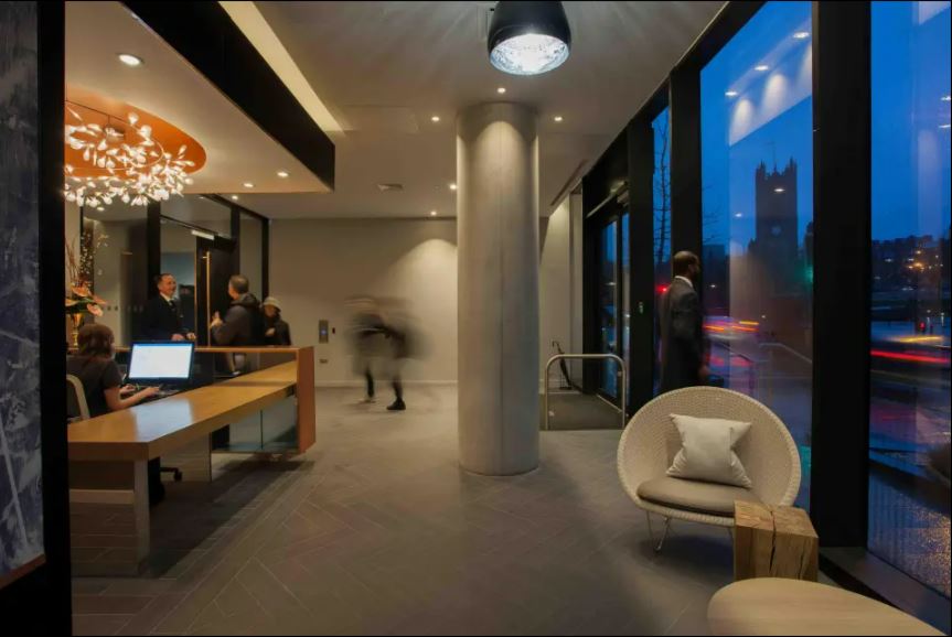 Lobby of an apartment building at night.