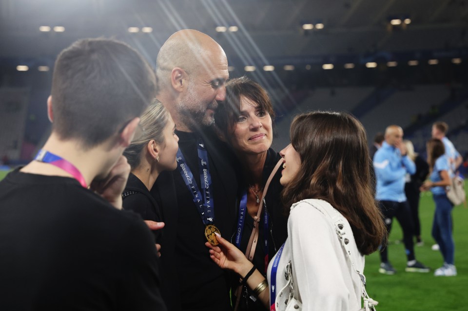 Pep Guardiola with his family celebrating a victory.