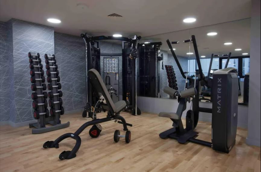 Gym with weight machines and free weights.