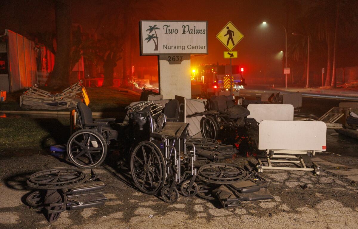 Abandoned wheelchairs and hospital beds outside the Two Palms Nursing Center in Altadena during the Eaton fire.