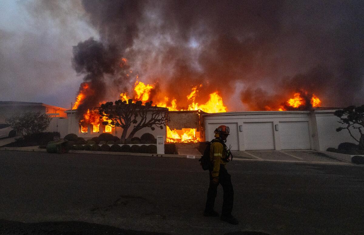 Firefighters battle the Palisades fire on Jan. 7.