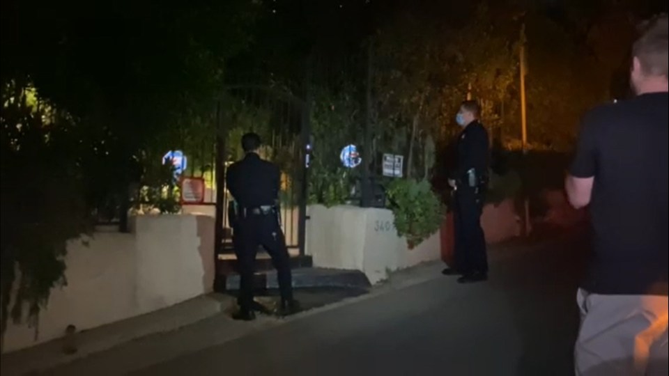 Police officers outside Marilyn Manson's Los Angeles home.