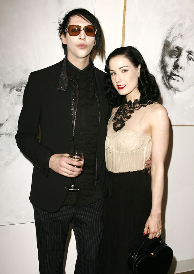 Marilyn Manson and Dita Von Teese at an art exhibition.