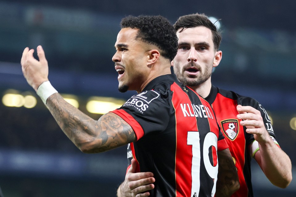 Justin Kluivert celebrating a goal with a teammate.