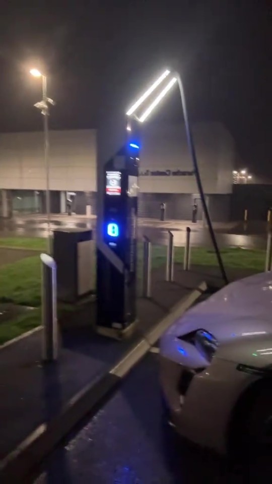 Electric car charging at night.