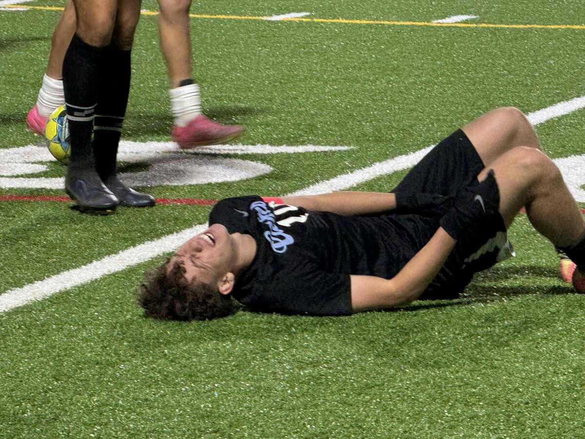 Jonathan Rabinovitch of ECR goes down with cramps in 3-0 win over Birmingham. He scored two goals.