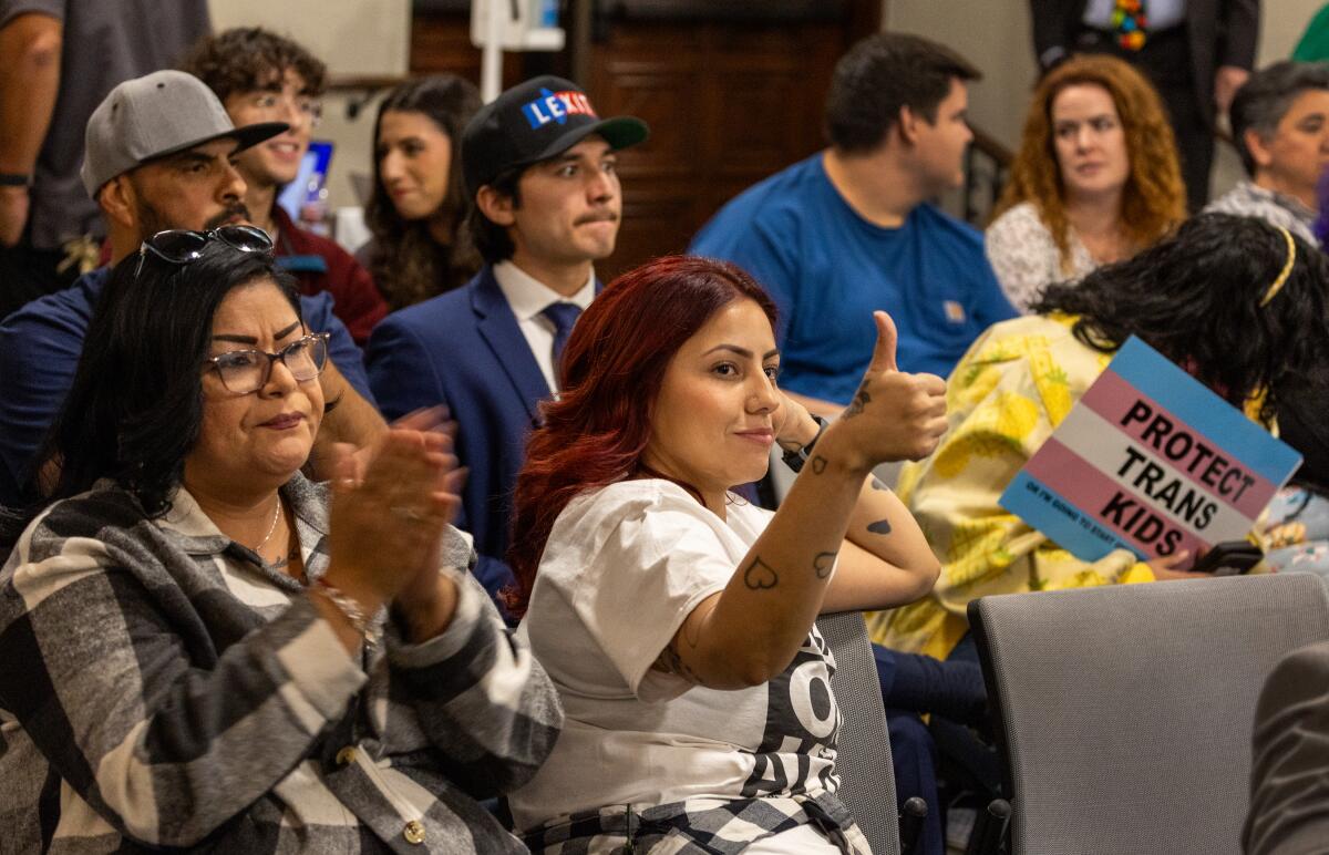 Save girls sports supporters cheer on a speaker