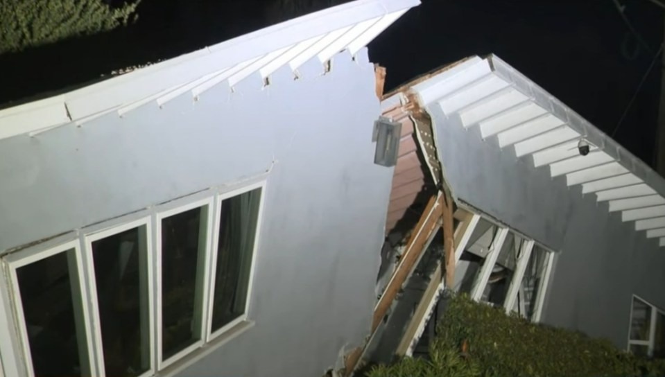 House damaged by fire and/or landslide.