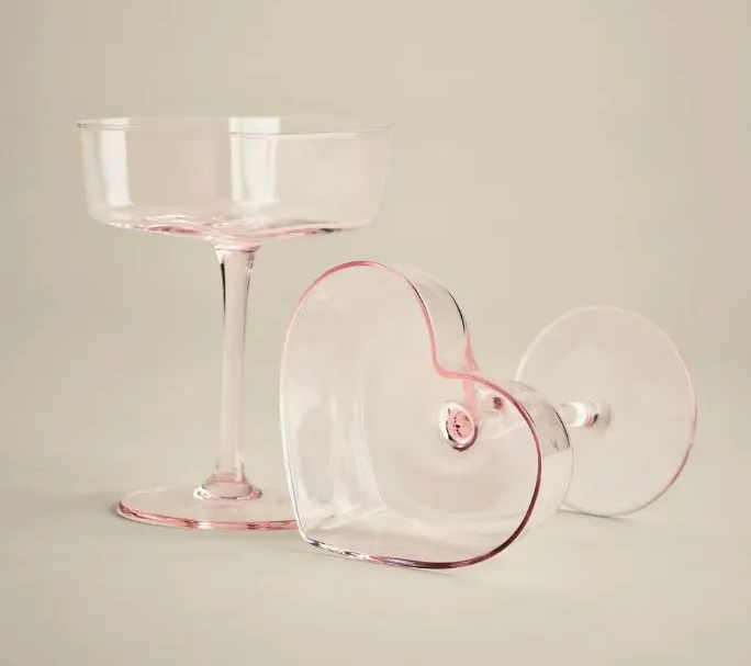 Pink coupe glass and heart-shaped glass.